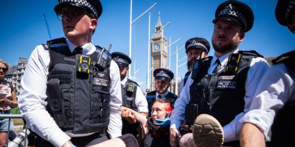 UK Police Arrest Dozens in Terror Law Protests